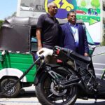 Vega International CEO Harsha Subasinghe (left) with Mahesh Nanayakkara, CEO of CDB with battery-powered motorbike and tuktuk. (Image from eShift LinkedIn page)